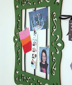 使用無痕相框掛扣掛起畫框
