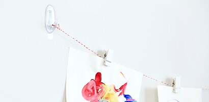 Display artwork on string with Command™ Quartz Spring Clips
